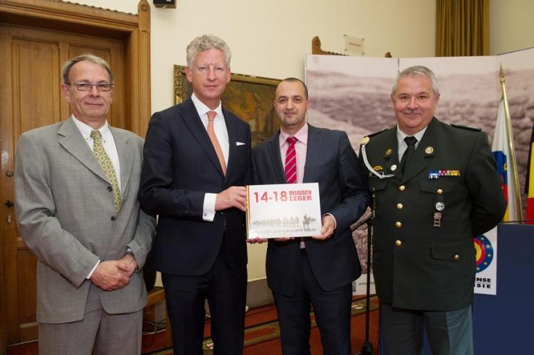 The authors of the book with the Minister : Major Rob Troubleyn, First Sergeant-Chief Malek Azoug and Adjudant Patrick Brion